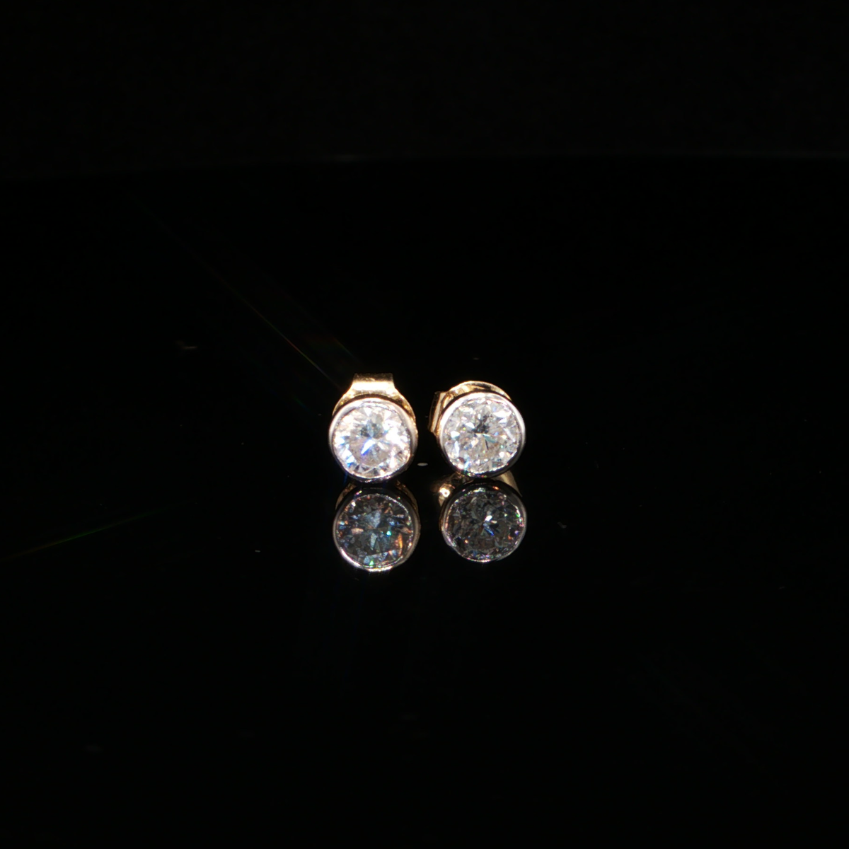 0.87 CTW Round Brilliant Cut Lab-Grown Diamond Bezel Stud Earrings in 14K Yellow Gold