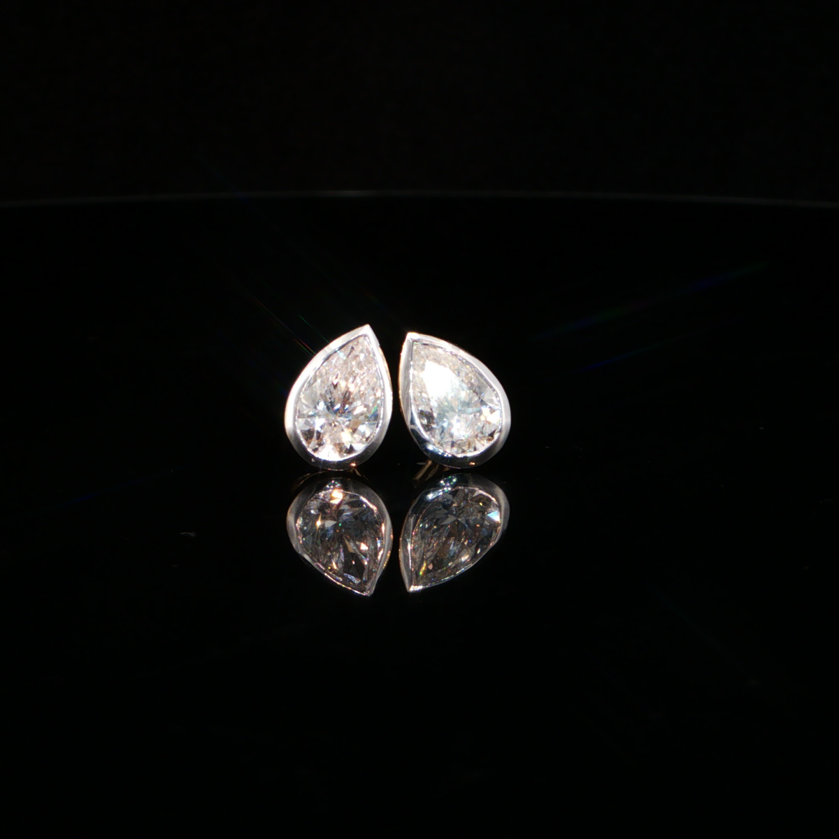 2.10 CTW Pear Cut Lab-Grown Diamond Bezel Stud Earrings in 14K Yellow Gold