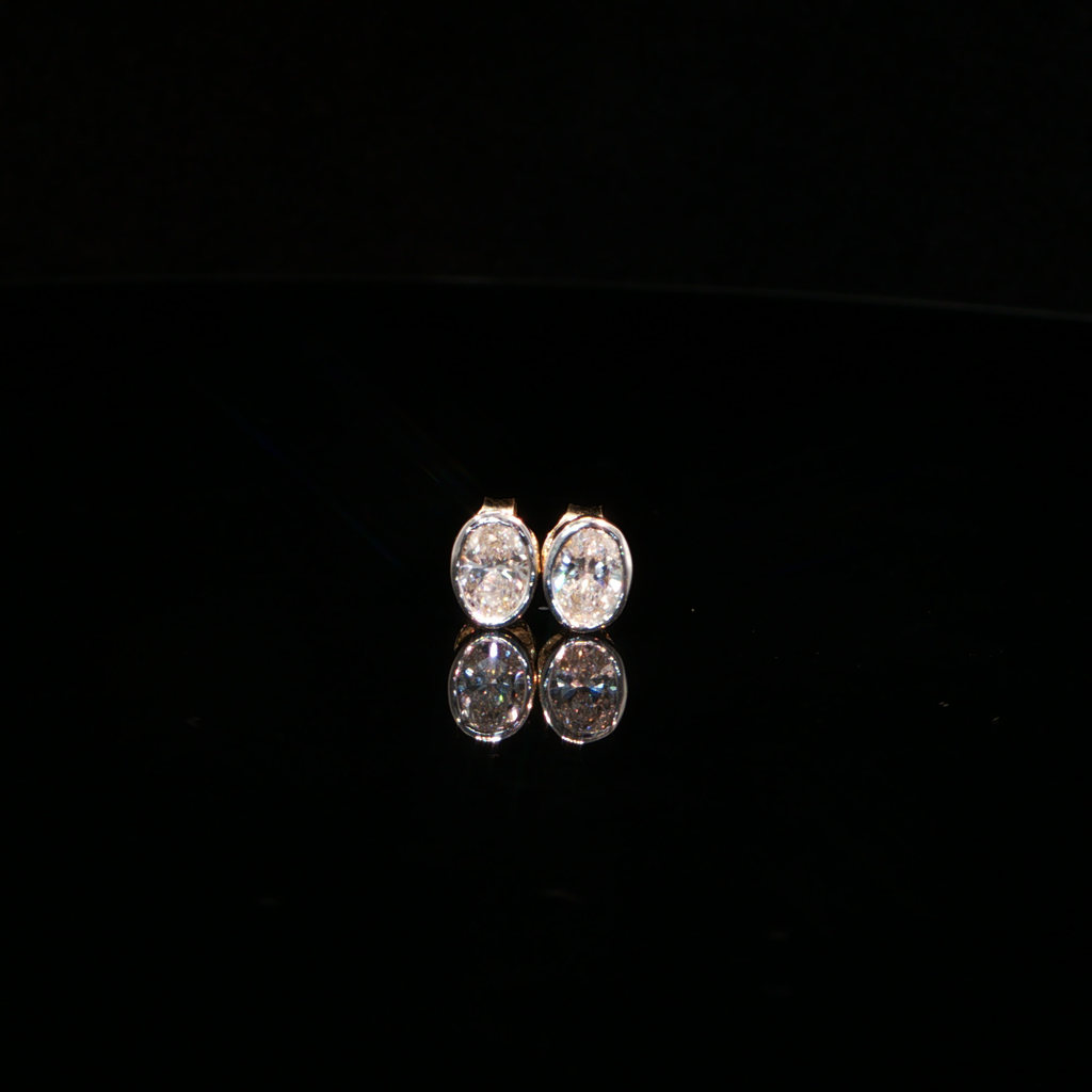 0.77 CTW Oval Cut Lab-Grown Diamond Bezel Stud Earrings in 14K Yellow Gold