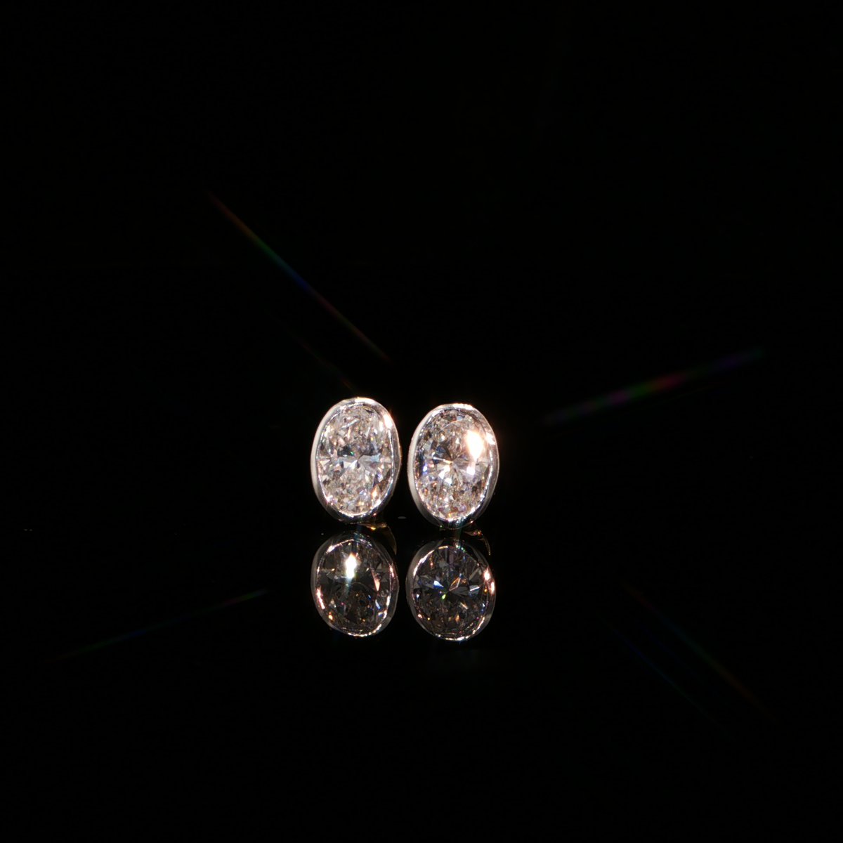 2.11 CTW Oval Cut Lab-Grown Diamond Bezel Stud Earrings in 14K Yellow Gold